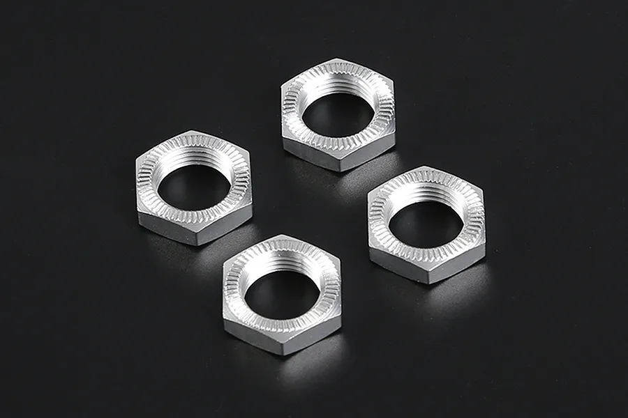 Four silver aluminium serrated wheel nuts for RC vehicles arranged on a black background.