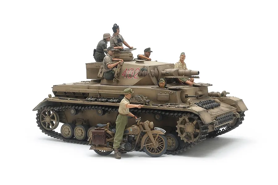 A 1/35 scale Tamiya German Panzer IV Ausf.F tank model kit, painted in desert tan with crew figures and a motorcycle on a white background.