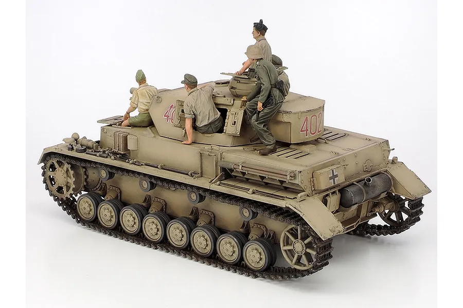 A 1/35 scale Tamiya German Panzer IV Ausf.F model tank painted in desert tan with four crew figures positioned on the turret and hull.