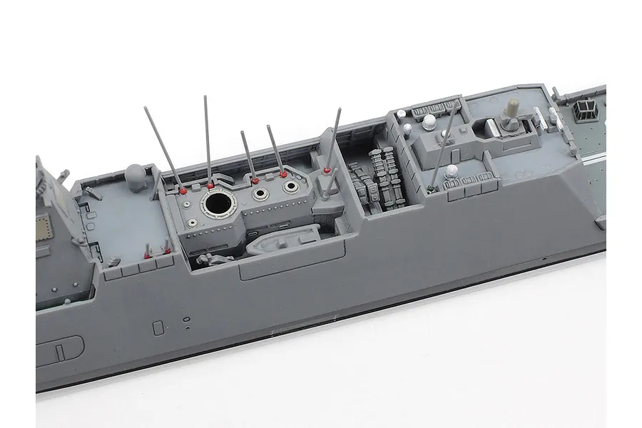 A close-up view of the mid-section deck of a 1/700 scale Tamiya JMSDF Mogami-class frigate model kit, showing detailed grey plastic parts.