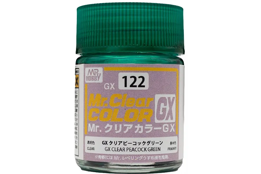 A close-up of a 10ml jar of Mr. Hobby GX Clear Peacock Green paint, showing the green cap and product label with text 122 and GX Clear Peacock Green.