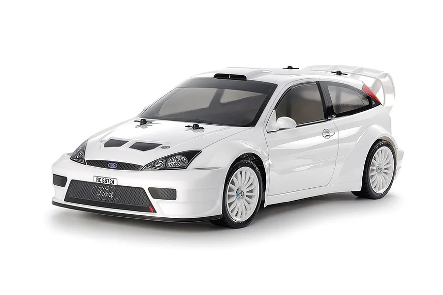 A studio shot of a white 1/10 scale Tamiya Ford Focus RS RC car on a white background.