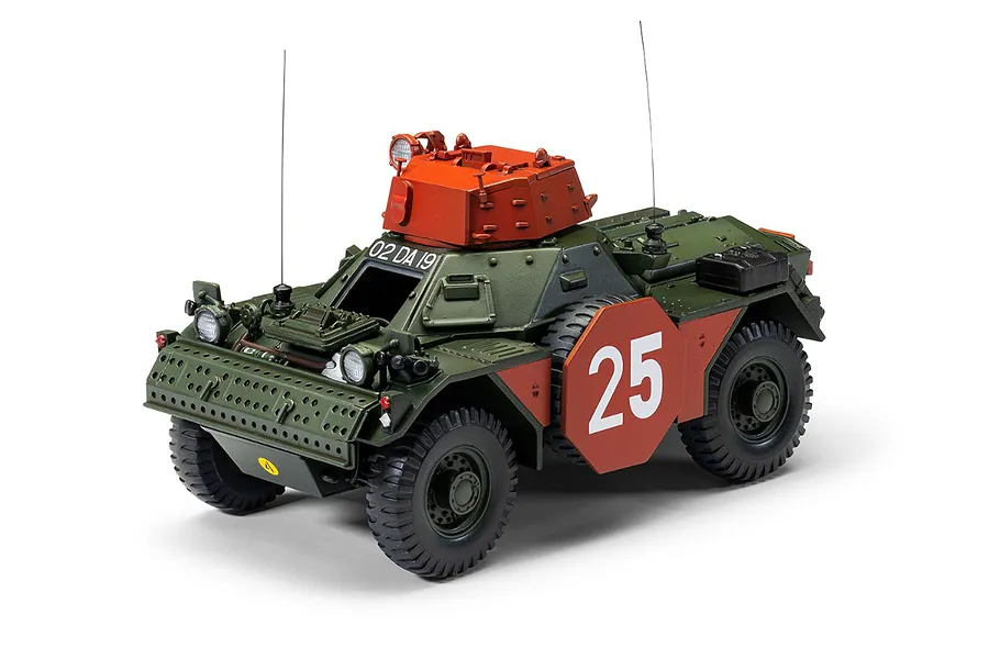 A fully assembled and painted 1/35 scale model of a Ferret Scout Car MK.2, featuring a green body, orange turret, and the number 25 on the side.