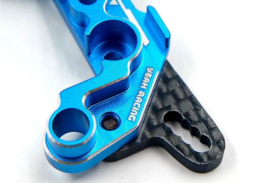 Close-up of a blue anodized aluminium and carbon fibre RC shock mount by Yeah Racing.