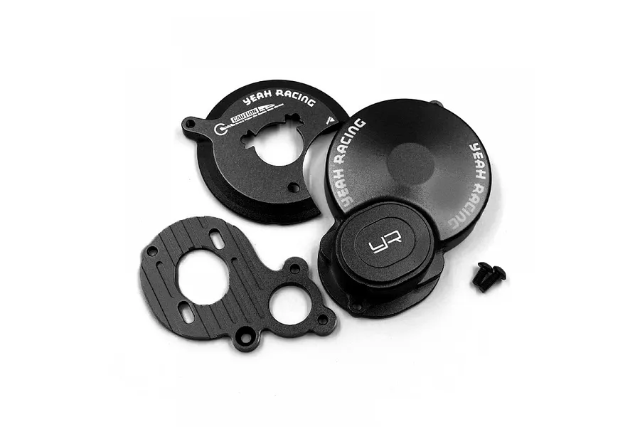 A set of black anodized aluminium RC car parts including a gear cover, motor mount plate, and small screws on a white background.