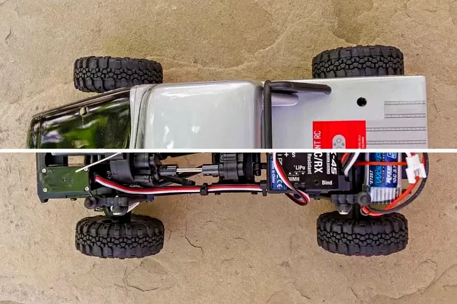 Top-down view of an Element RC Enduro24 Ecto rock crawler, showing the body shell on top and the internal chassis components below.