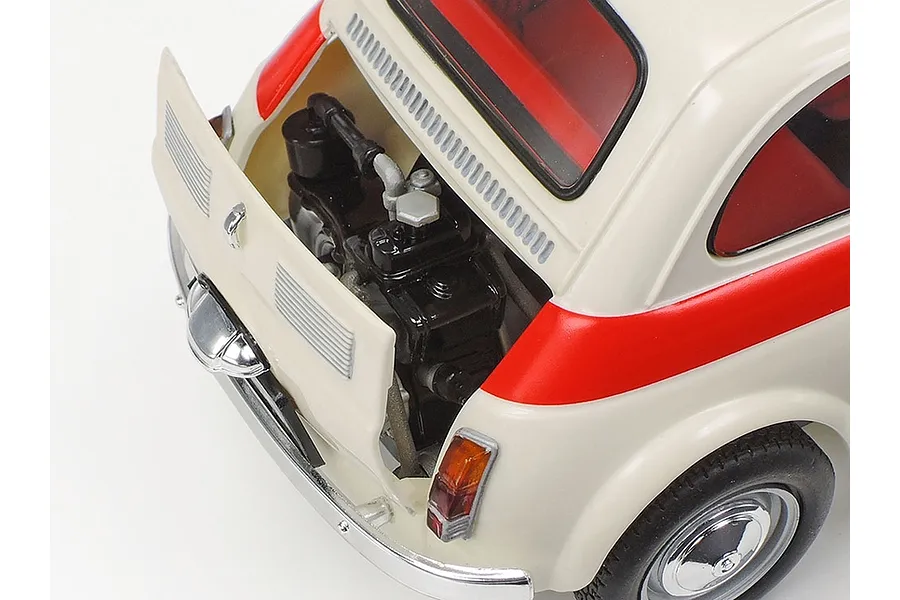 Close-up of the rear engine bay of a Tamiya 1/24 scale Fiat 500F model car with the engine cover open.