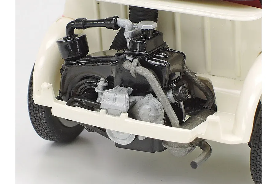 Close-up of the detailed engine bay of a Tamiya 1/24 scale Fiat 500F plastic model car kit, showing the rear-mounted engine assembly.