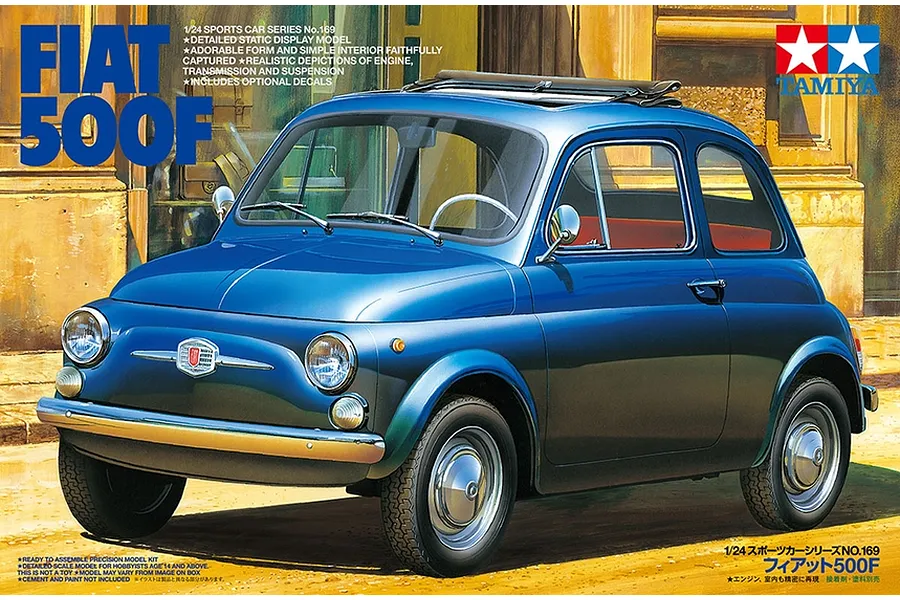 Box art for Tamiya 1/24 scale Fiat 500F plastic model kit showing a blue classic Fiat 500 car parked on a street.