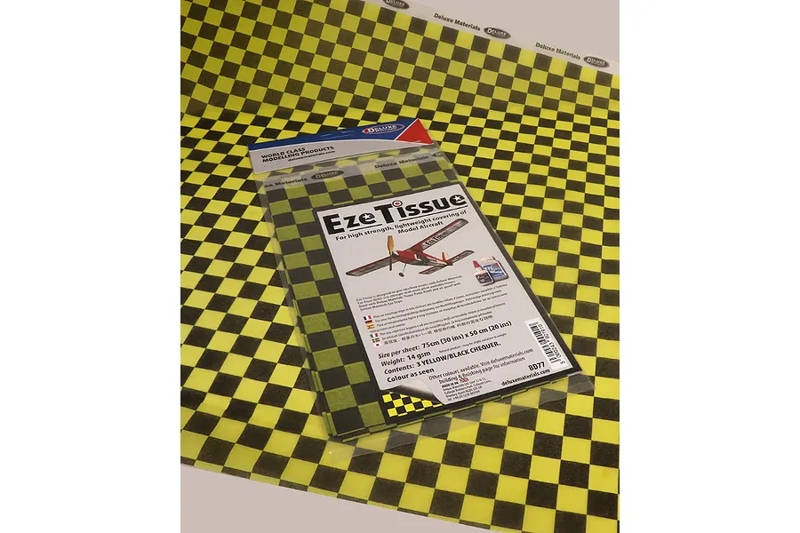 A package of Deluxe Materials Eze Tissue in a yellow and black checkered pattern, laid over a matching sheet of the same tissue paper.