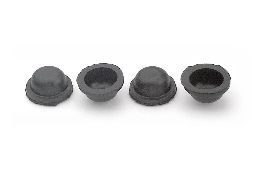 Four black silicone shock membranes for RC car suspension arranged in a row against a white background.