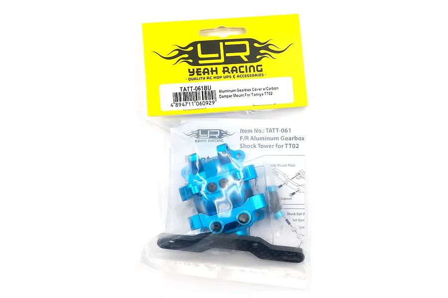 Yeah Racing TATT-061BU blue aluminium gearbox cover with carbon shock absorber mount in original retail packaging.