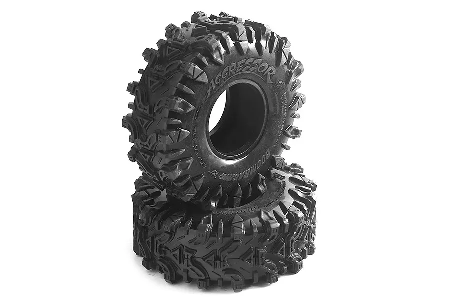 Two Boom Racing 1.9 inch Aggressor crawler tyres stacked on a white background, featuring aggressive tread patterns and embossed sidewall branding.