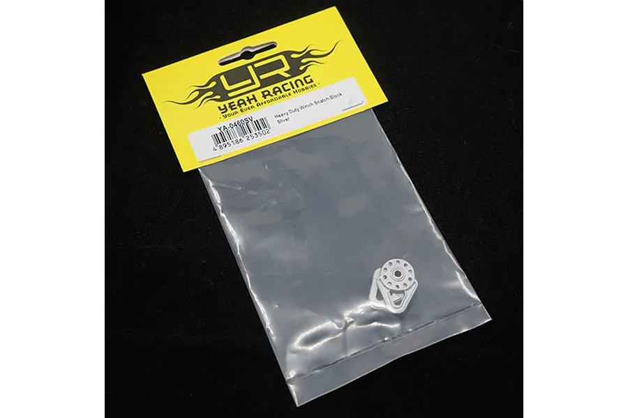 A silver Yeah Racing heavy duty winch snatch block in its original retail packaging against a black background.