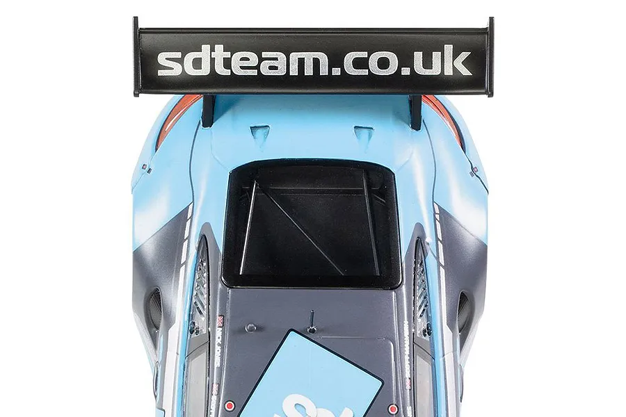 Top-down view of the rear section of a Scalextric Porsche 911 GT3 R slot car, showing the large rear wing with sdteam.co.uk branding.