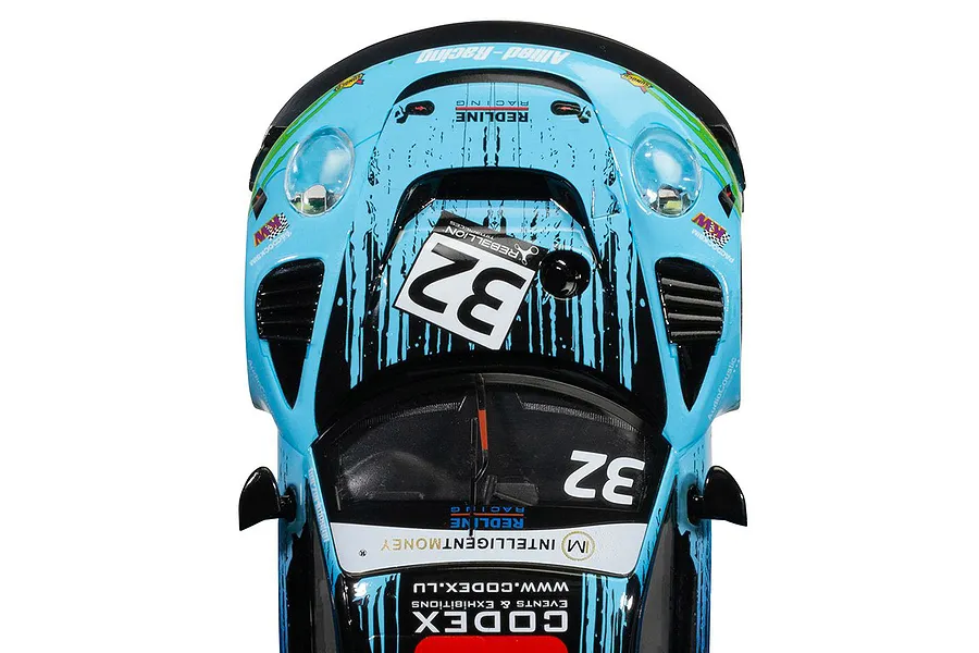 Top-down view of a Scalextric 1/32 scale Porsche 911 GT3 R slot car in light blue and black Redline Racing livery with number 32.