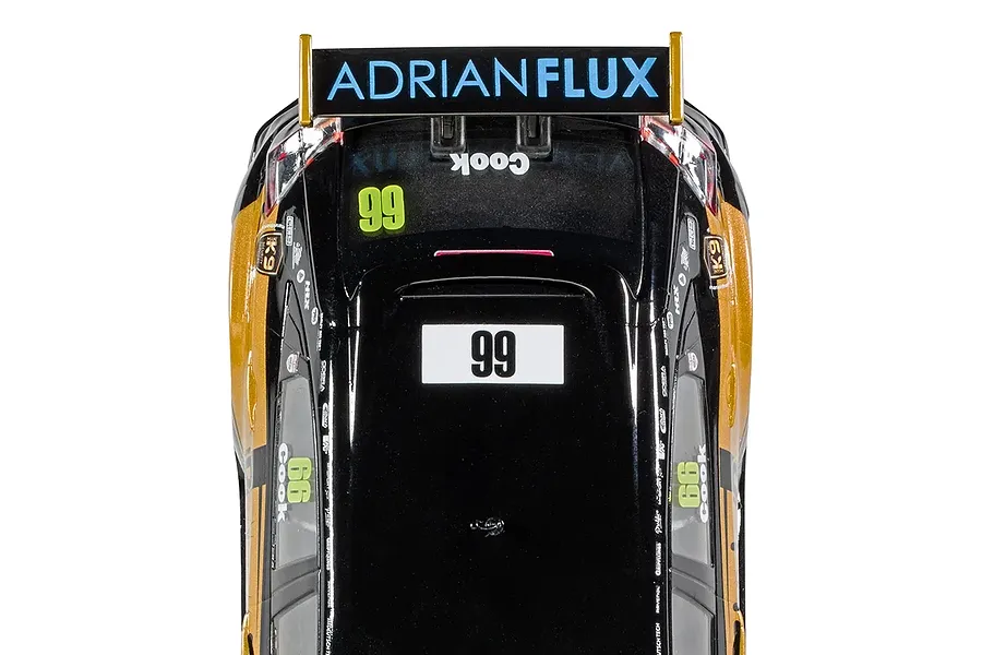 Top-down view of a Scalextric 1/32 scale Honda Civic FK8 Type R BTCC slot car, featuring black and gold livery with number 99 and Adrian Flux branding.