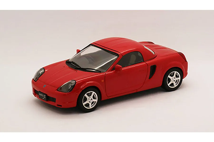 A red 1/24 scale plastic model of a Toyota MR-S sports car on a white background.