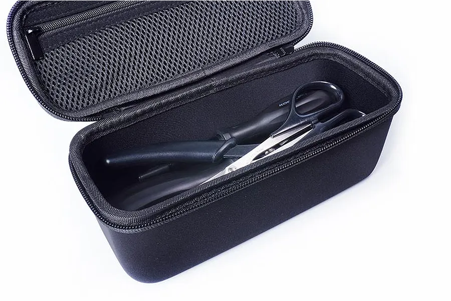 Open black Koswork hard case containing a pair of black handled scissors on a white background.