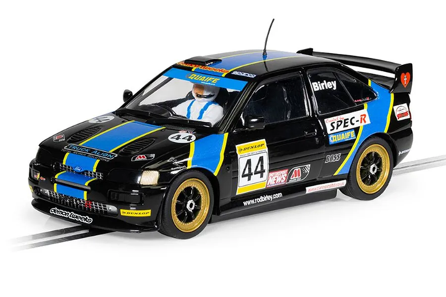 Scalextric 1/32 scale Ford Escort Cosworth slot car in black and blue livery with number 44, featuring gold wheels and sponsor decals.