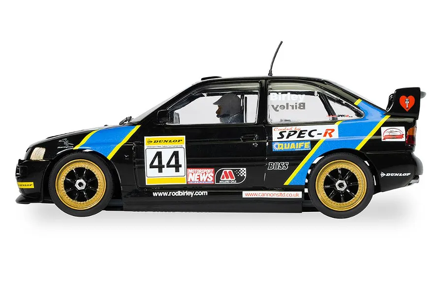 Side profile of a 1/32 scale Scalextric Ford Escort Cosworth slot car in black with blue and yellow racing livery, number 44, and gold wheels.