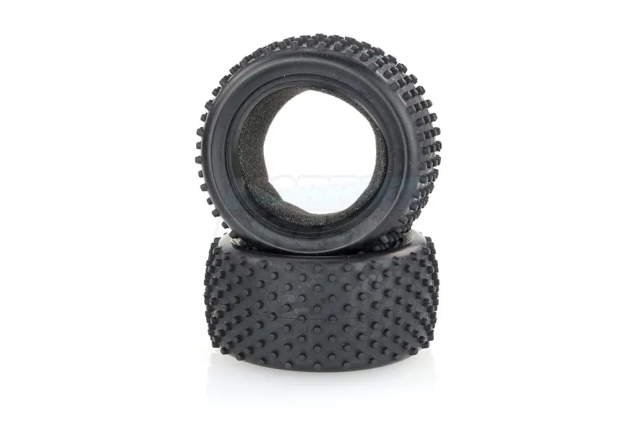 Two black rubber RC buggy rear pin tyres stacked on top of each other against a white background.
