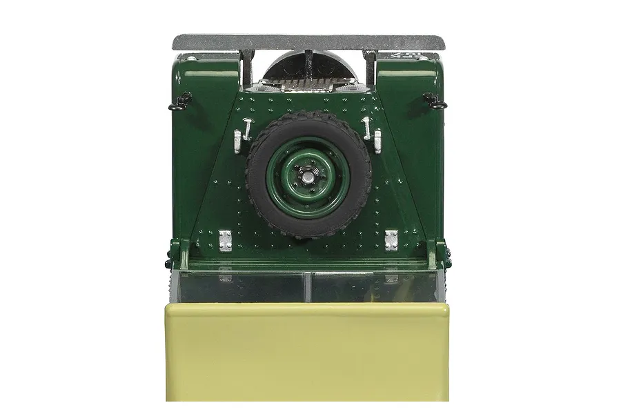 Top-down view of the hood of a green Scalextric 1/32 scale Land Rover Series 1 slot car, showing the mounted spare tire.