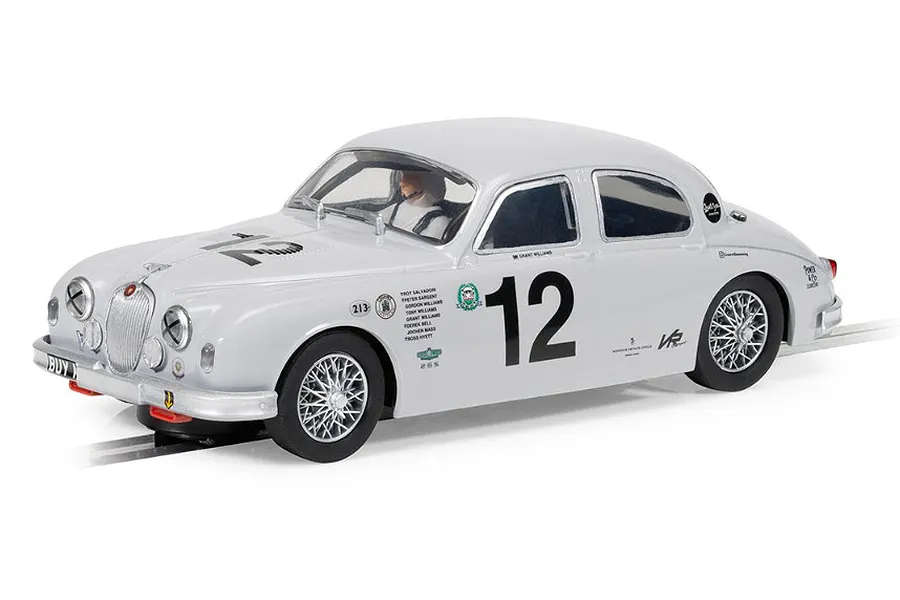 A 1/32 scale Scalextric Jaguar MK1 slot car in white with racing number 12, featuring detailed wire wheels and sponsor decals on a white background.