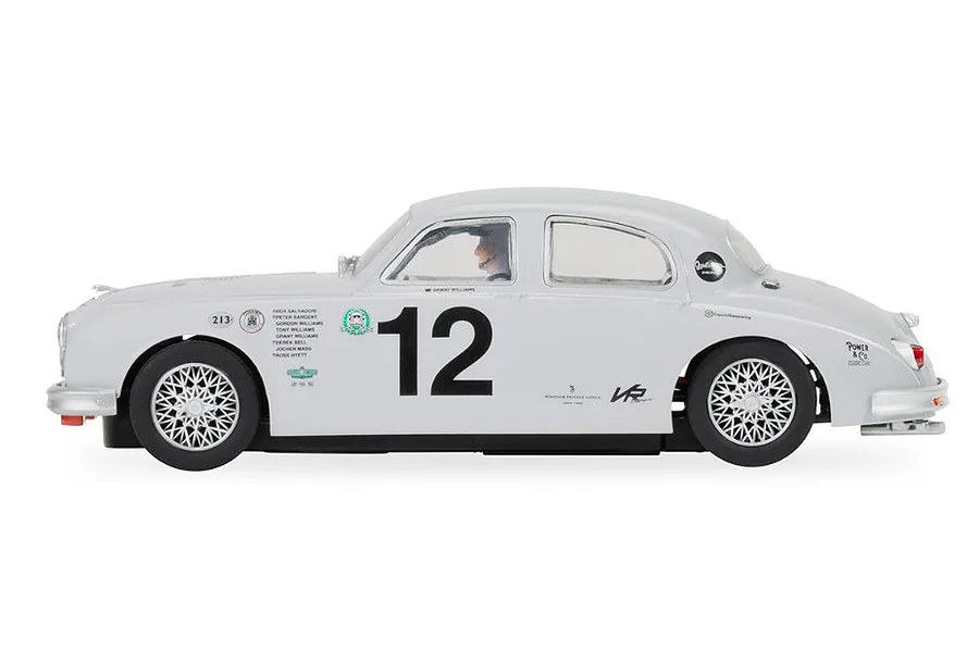 A side profile view of a light grey Scalextric 1/32 scale Jaguar MK1 slot car with the number 12 on the door.