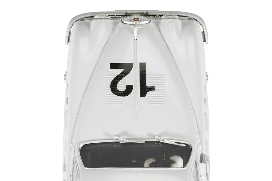 Top-down view of a white Scalextric Jaguar MK1 slot car with the number 12 on the hood.