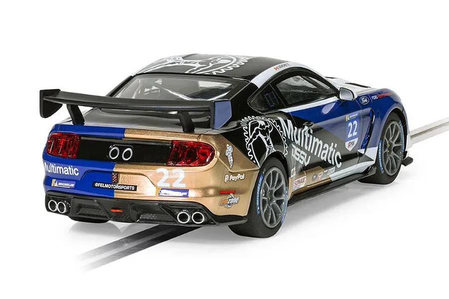 Rear three-quarter view of a Scalextric 1/32 scale Ford Mustang GT4 slot car in Multimatic livery with number 22, sitting on a slot car track.