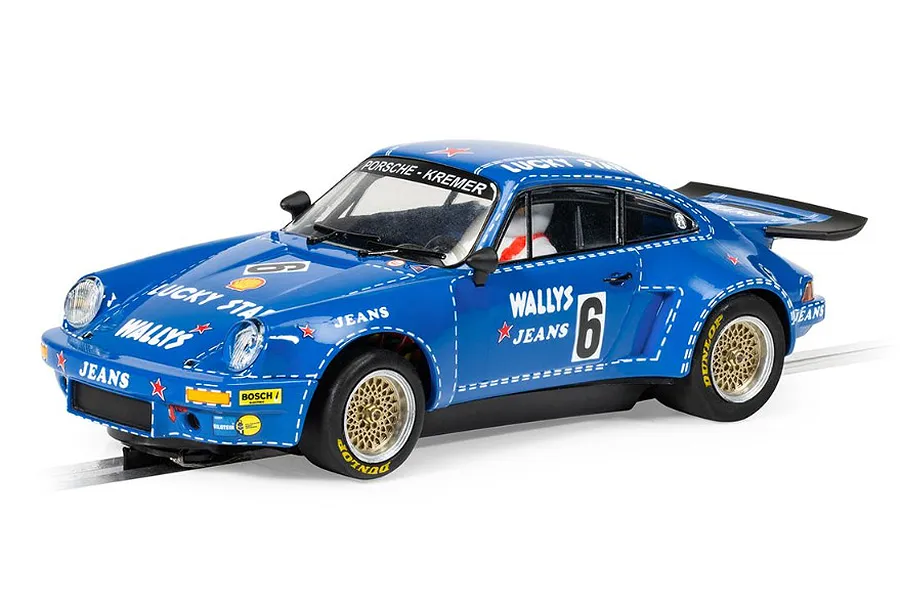 A 1/32 scale Scalextric slot car model of a blue Porsche 911 Carrera RSR 3.0 with Wallys Jeans livery and racing number 6.