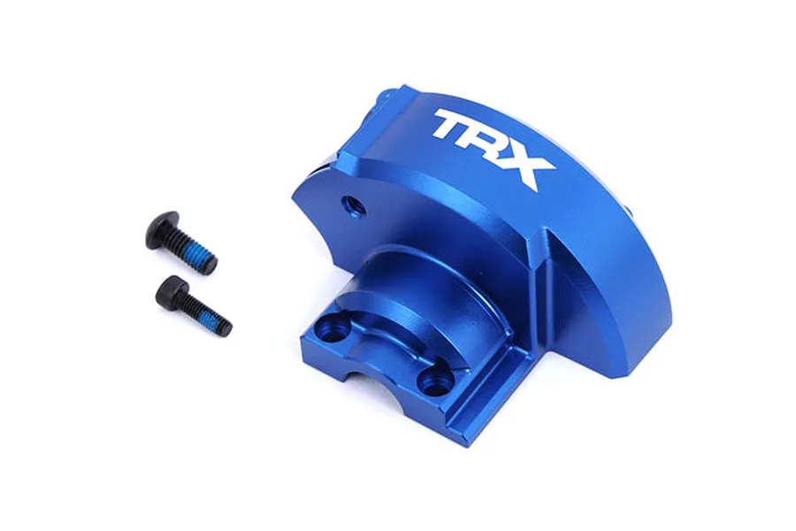 A blue anodized aluminium gear cover for Traxxas RC vehicles with the TRX logo printed on top, accompanied by two black mounting screws.