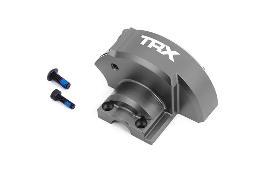 Traxxas grey aluminium gear cover with two mounting screws on a white background.