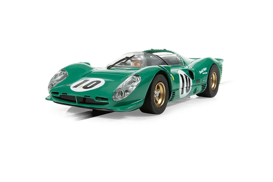 A green Scalextric 1/32 scale Ferrari 330 P4 slot car, number 10, driven by David Piper, shown from a front three-quarter angle.