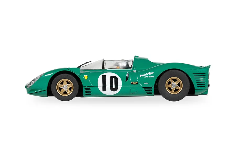 Side profile of a green Scalextric 1/32 scale Ferrari 330 P4 slot car, number 10, driven by David Piper, against a white background.