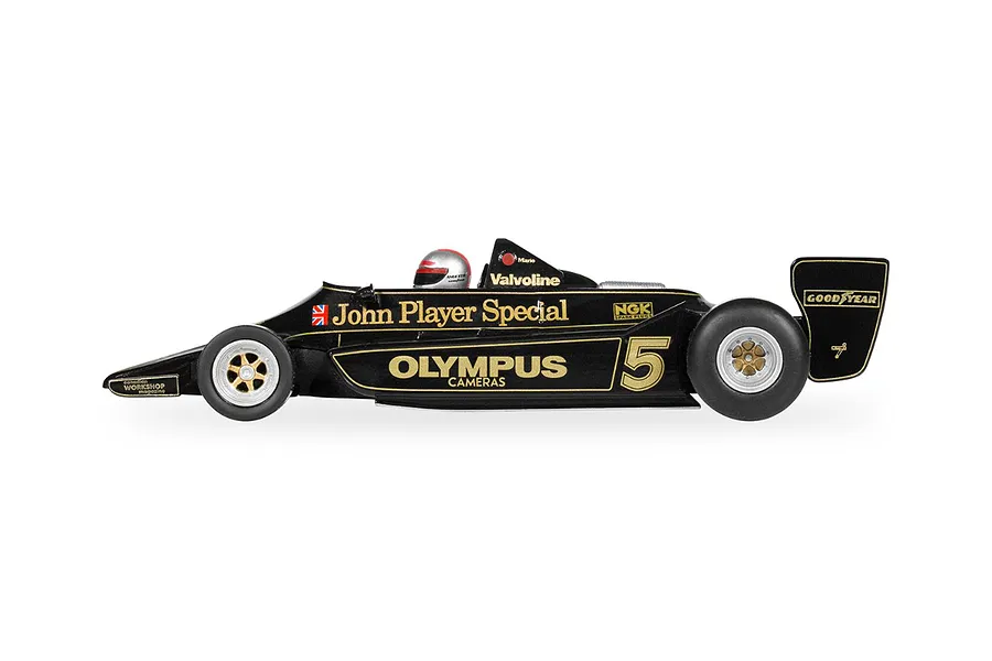 Side view of a black and gold Scalextric 1/32 scale Lotus 79 slot car, number 5, driven by Mario Andretti.