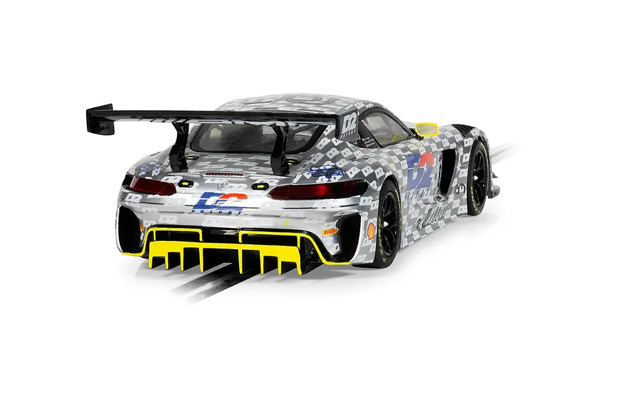 Rear three-quarter view of a Scalextric 1/32 scale Mercedes-AMG GT3 slot car with a silver and grey patterned livery and yellow accents.