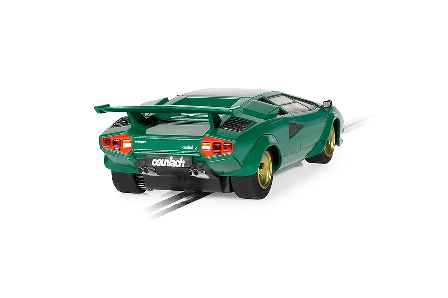 Rear three-quarter view of a green Scalextric 1/32 scale Lamborghini Countach slot car on a track.