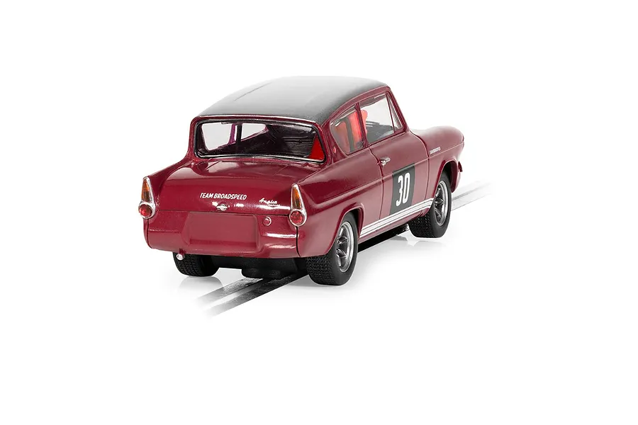 Rear three-quarter view of a maroon Scalextric Ford Anglia 105E Broadspeed slot car with number 30 on the door, sitting on a slot car track.