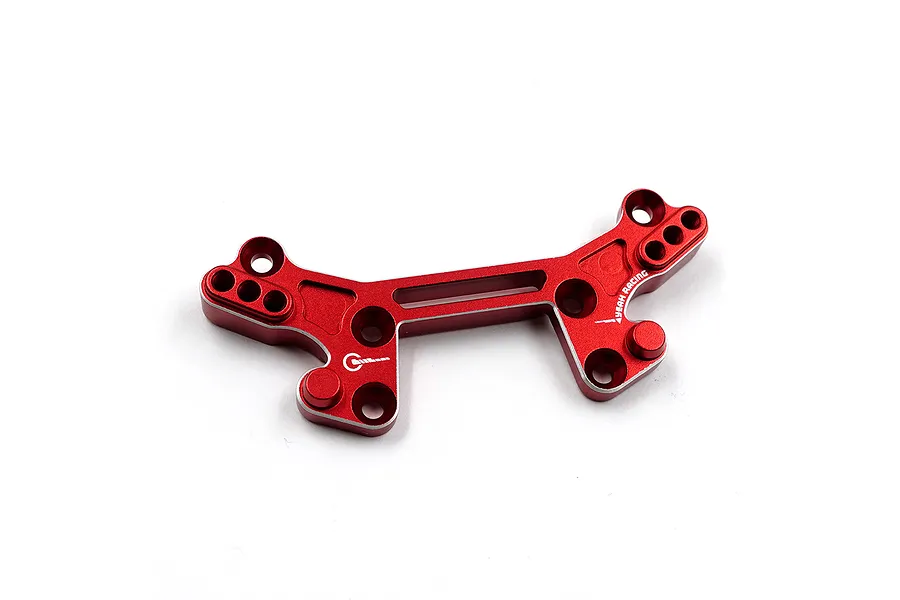 A red anodized aluminium rear shock tower for an RC car by Yeah Racing, featuring multiple mounting holes and a branded logo.