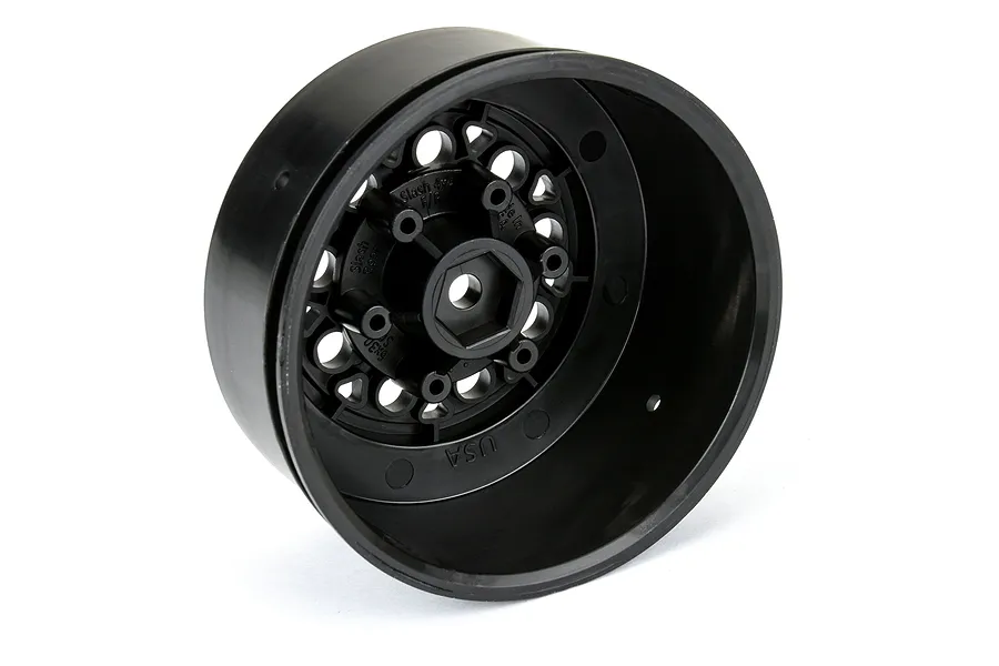 A black Pro-Line 2.2/3.0 inch short course RC wheel rim shown from an angled perspective against a white background.