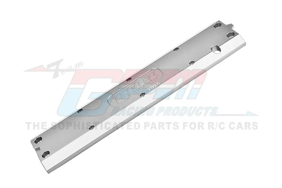 A silver aluminium chassis skid plate for RC cars by GPM Racing, featuring machined mounting holes and engraved branding.