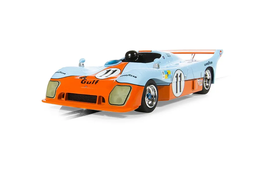 A 1/32 scale Scalextric Mirage GR8 slot car in iconic Gulf light blue and orange livery with number 11 decals, viewed from a front three-quarter angle.