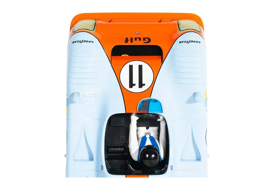 Top-down view of a Scalextric 1/32 scale Mirage GR8 slot car in iconic Gulf light blue and orange livery with number 11.
