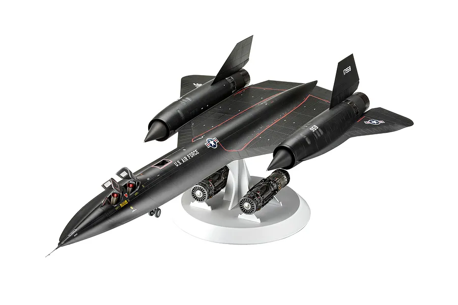 A fully assembled and painted 1/48 scale plastic model of a Lockheed SR-71A Blackbird aircraft, mounted on a white display stand with two spare engines.