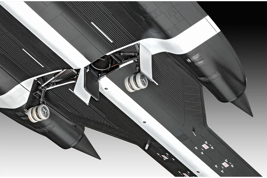 Underside view of a detailed plastic model of an SR-71 Blackbird aircraft showing the landing gear and engine nacelles.