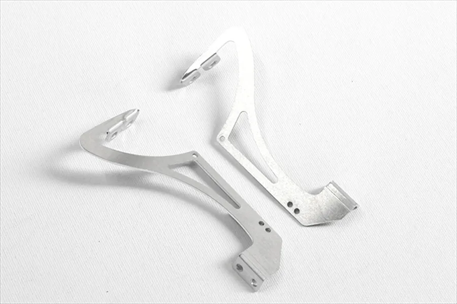 A pair of silver aluminium swan neck rear wing mounts for 1/10 scale RC cars, shown from an overhead angle on a white background.