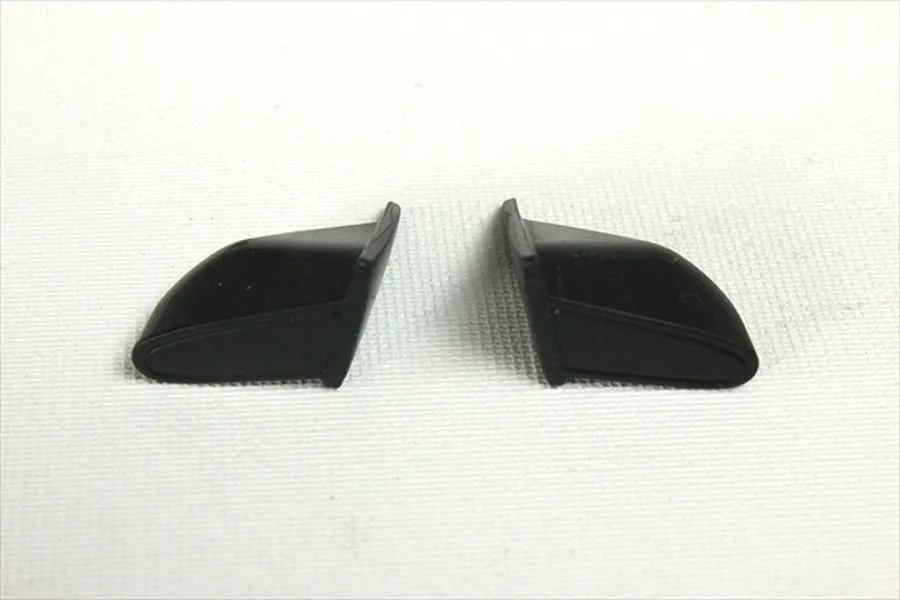 A pair of black unpainted 1/10 scale aero door mirrors for RC car bodies on a white background.