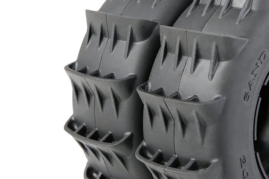 Close-up view of two black Rovan 1/5 scale paddle tyres for RC buggies, showing the deep tread pattern.